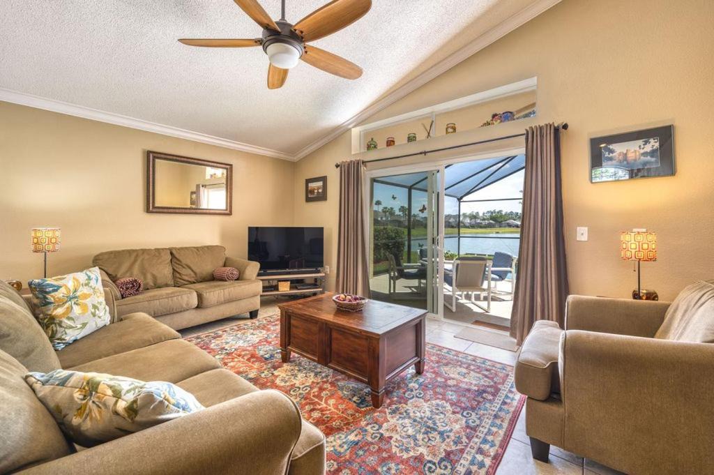 Lake Berkley Villa | Charming 3BR home in Kissimmee with private pool and lake view, perfect for families.