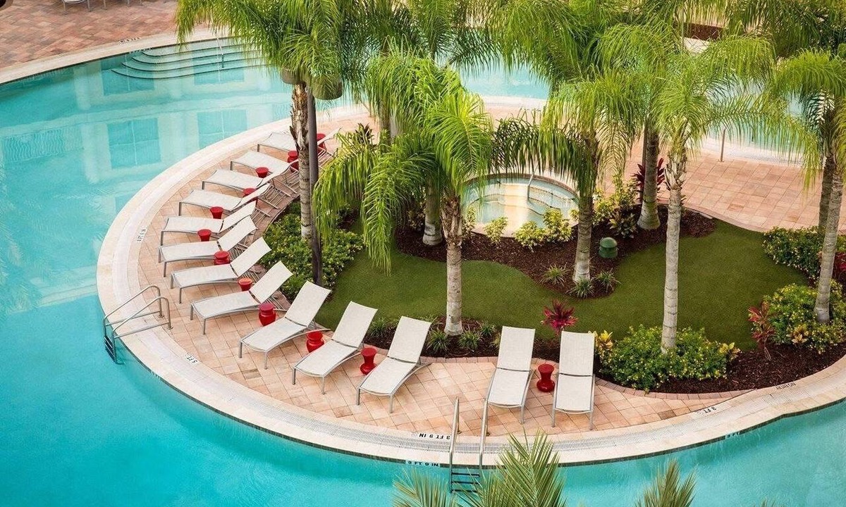 Celebration Apartment | WALK OUT UNIT TO POOL! 2-Bedroom, 2- Bath Corner Suite Minutes from Disney!