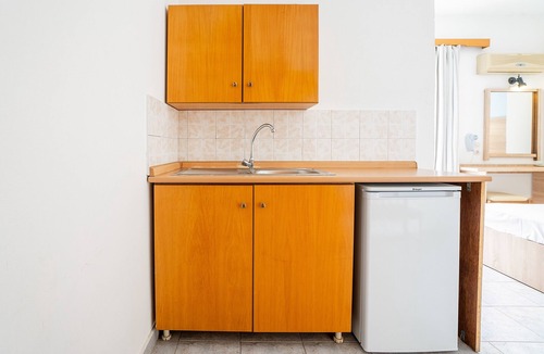 Faliraki Apartment | Holiday Apartment "Sotirakis Standard Room 1" with Mountain View, Shared Pool & Wi-Fi