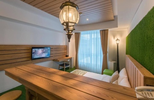 Kartika Plaza Hotel | King Bed Thematic Room in Kuta Beach Area