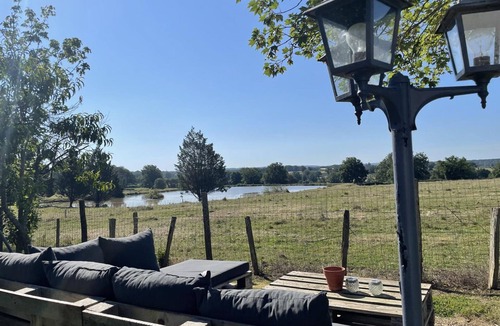 Isle-et-Bardais Cottage | Renovated farmhouse with private pond, pets allowed