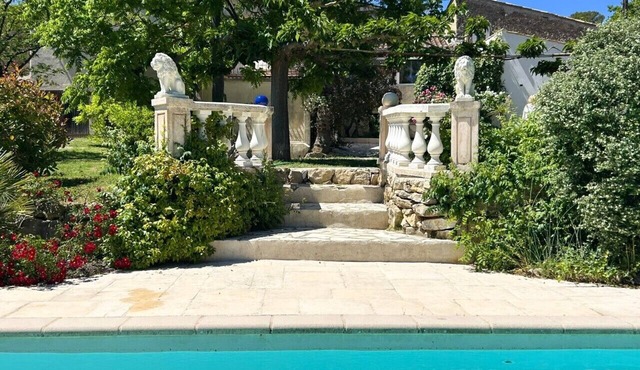 A charming country house with a garden and swimming pool.