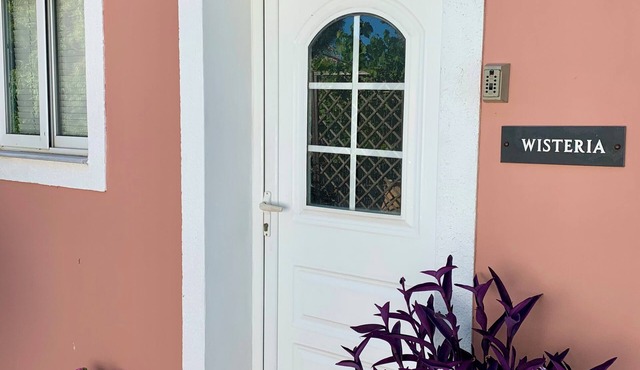 Charming Villa with Garden, 10-Min Walk to St. George Beach, Close to Amenities