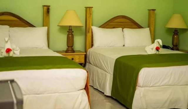 Deluxe Quadruple Room, 2 Queen Beds, Garden View