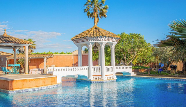 Luxury studio-style room across from the pool with a private terrace