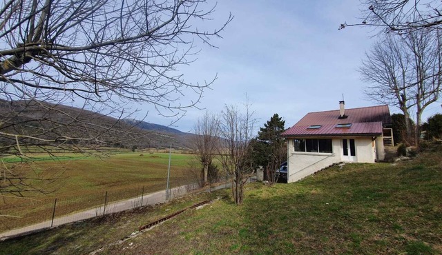 Old sheepfold surrounded by fields and mountains