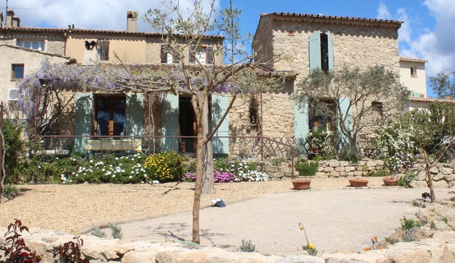 Typical stone house with garden in a quiet hamlet surrounded by vineyards