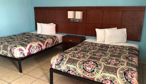 Suite three queen beds no smoking ground floor